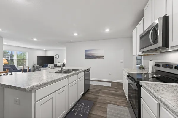 a bathroom with a granite countertop sink a mirror and a