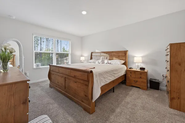 a view of a workspace with furniture and a cabinet