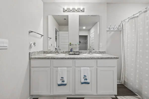 a bedroom with a bed and a night lamp