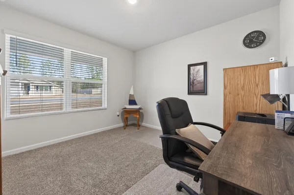 a house view with wooden fence and a big yard