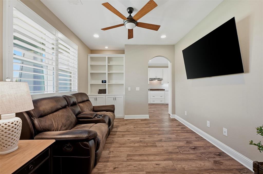 662 Preakness Place Road Van Alstyne, TX 75495 - Photo 6 of 39 a living room with furniture and a flat screen tv
