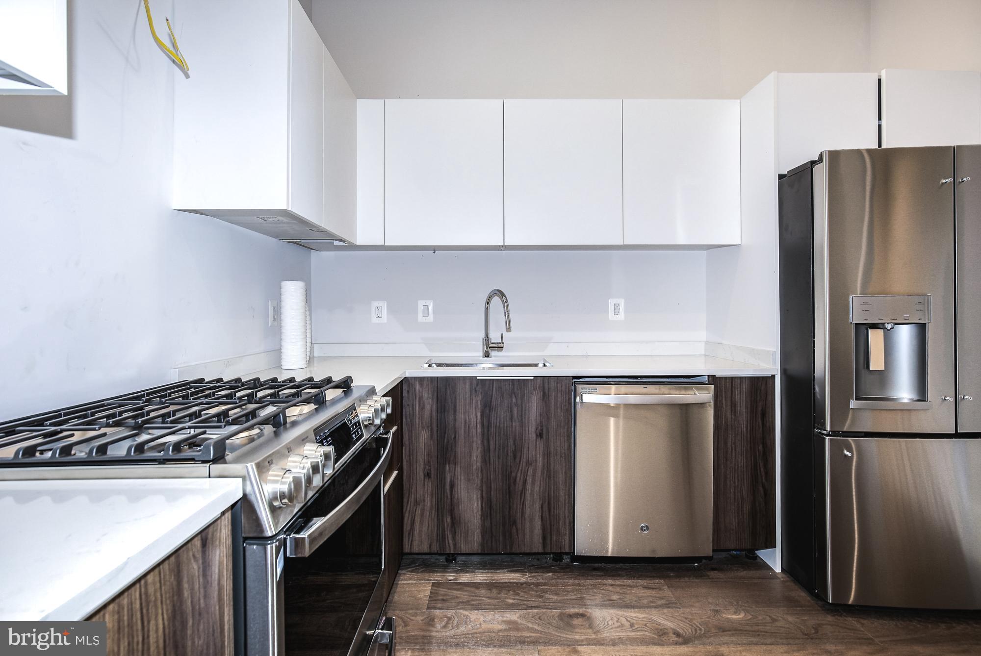 6160 Hardy Drive McLean, VA 22101 - Photo 13 of 41 a kitchen with stainless steel appliances granite countertop a sink stove and refrigerator