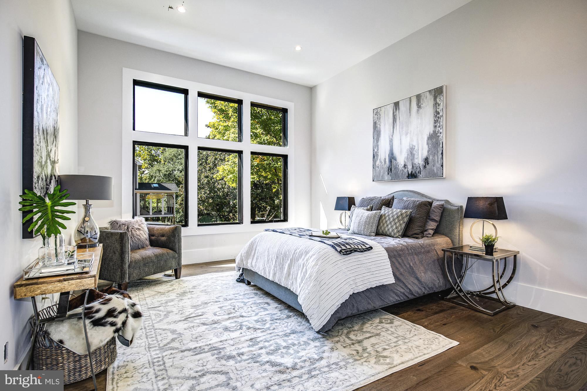 6160 Hardy Drive McLean, VA 22101 - Photo 15 of 41 a bedroom with a bed and a large window