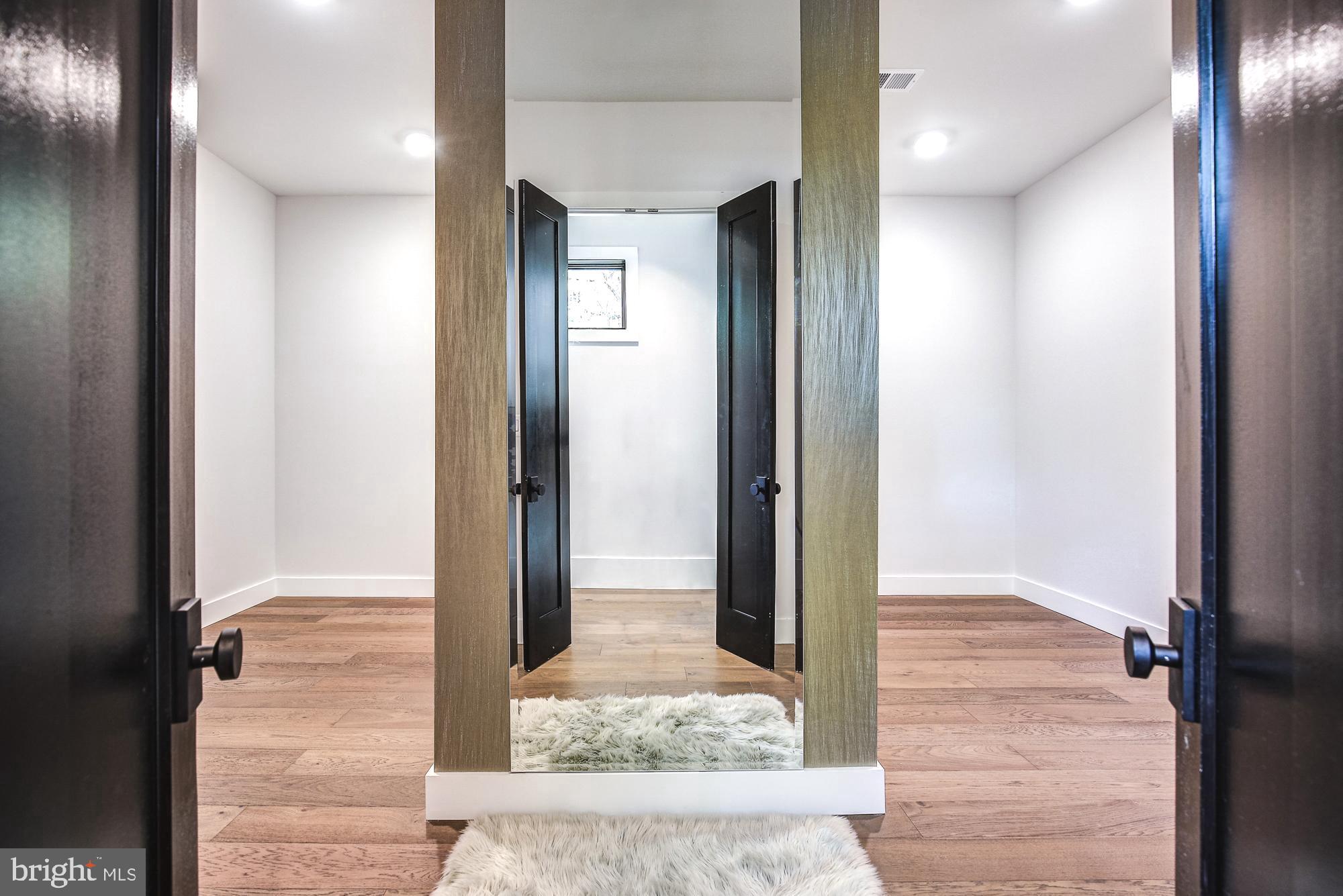 6160 Hardy Drive McLean, VA 22101 - Photo 20 of 41 a view of a hallway with wooden floor and staircase
