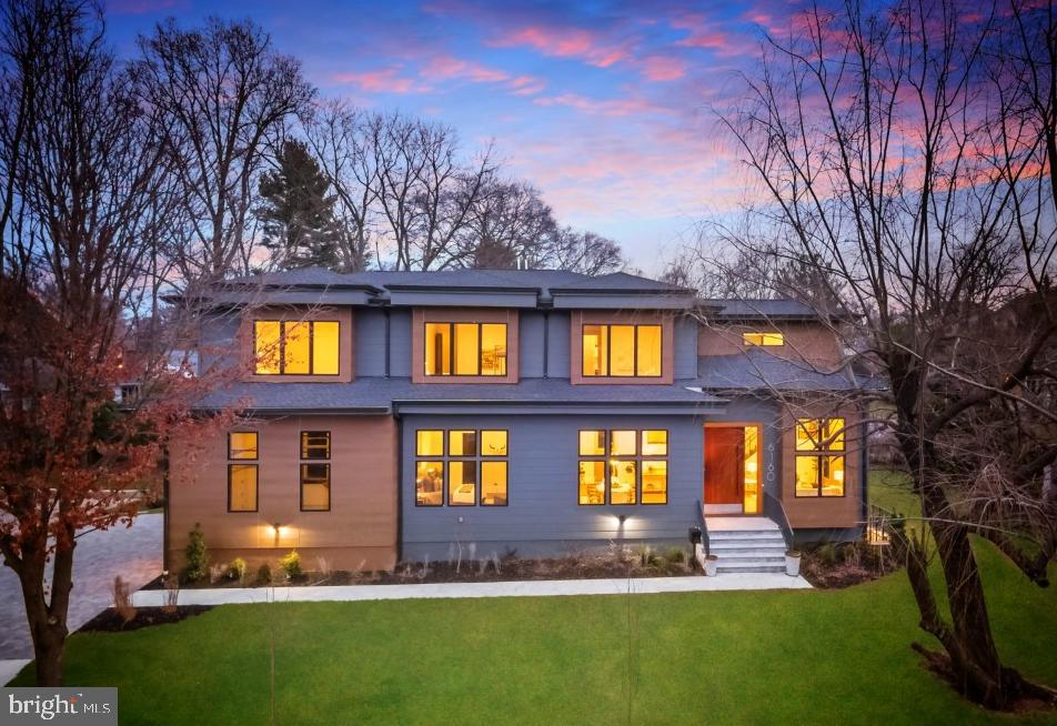 6160 Hardy Drive McLean, VA 22101 - Photo 2 of 41 a view of a brick house with a big yard and large trees