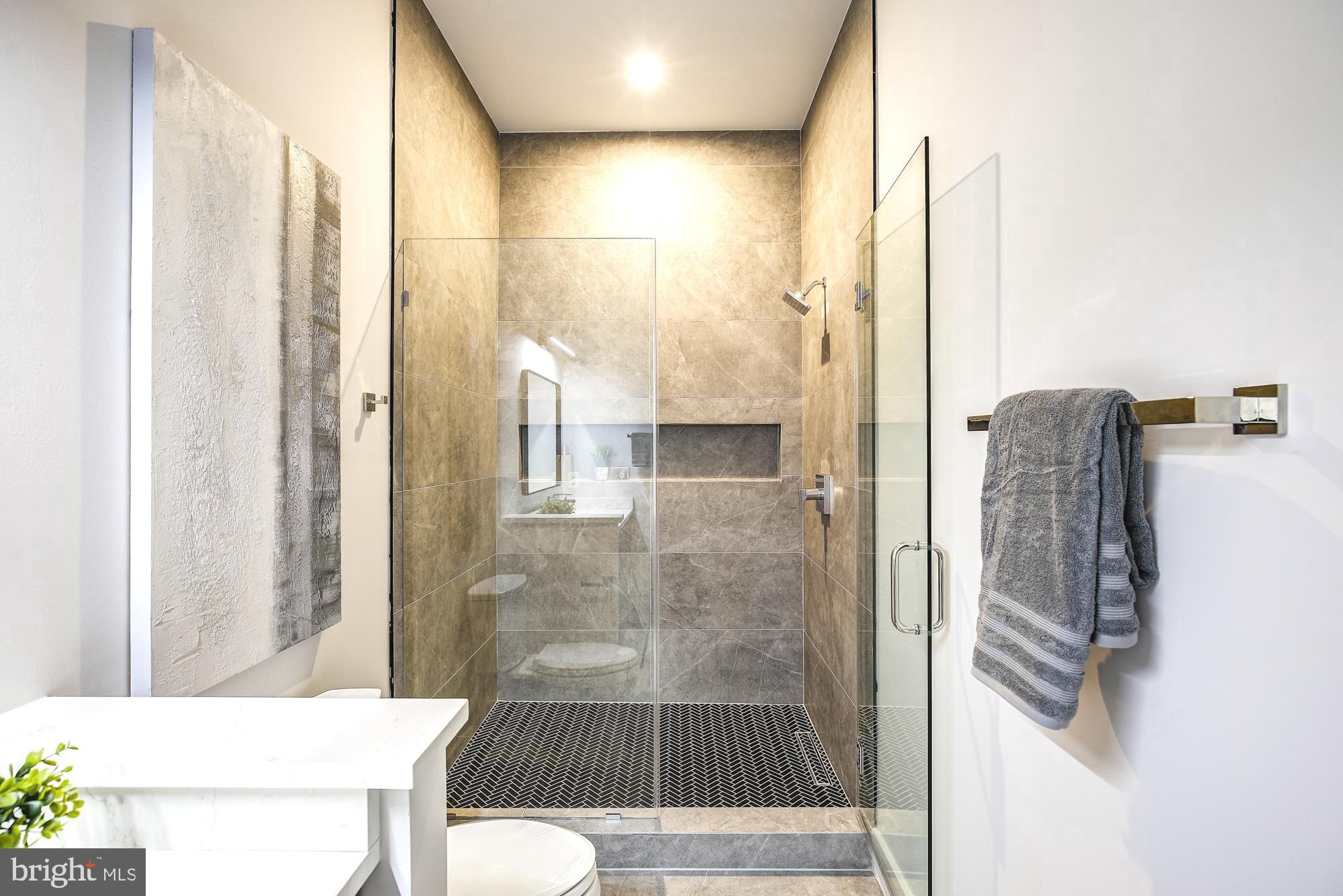 6160 Hardy Drive McLean, VA 22101 - Photo 22 of 41 a bathroom with a shower