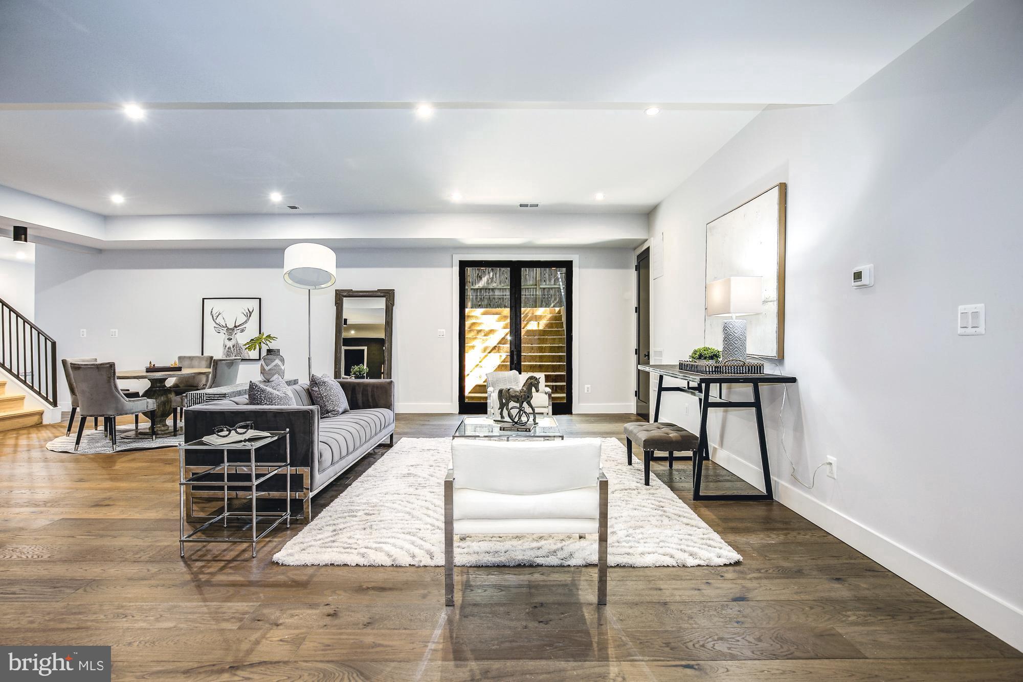 6160 Hardy Drive McLean, VA 22101 - Photo 29 of 41 a living room with furniture two large window and wooden floor