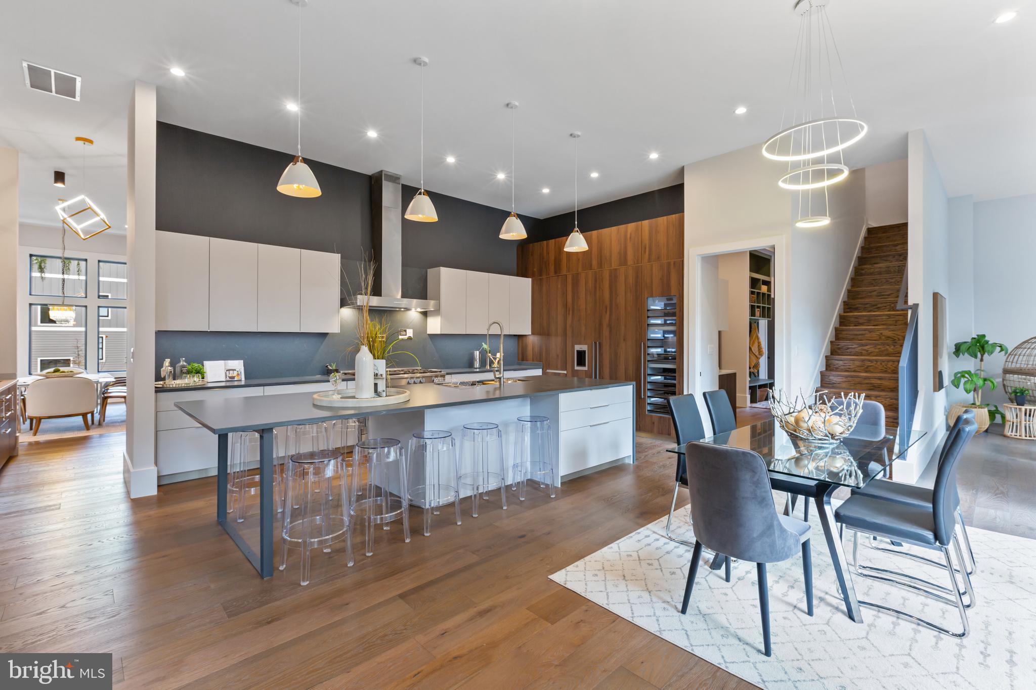 6160 Hardy Drive McLean, VA 22101 - Photo 10 of 41 a kitchen with a table chairs and a large window