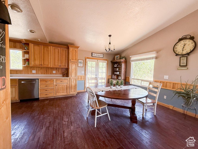 425 East Mule Deer Road Central, UT 84722 - Photo 12 of 72 Dining space featuring vaulted ceiling, dark wood-style flooring, french doors, a textured ceiling, and a chandelier