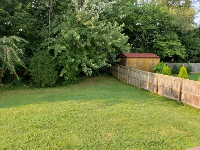 a view of a swimming pool with an outdoor space and seating area