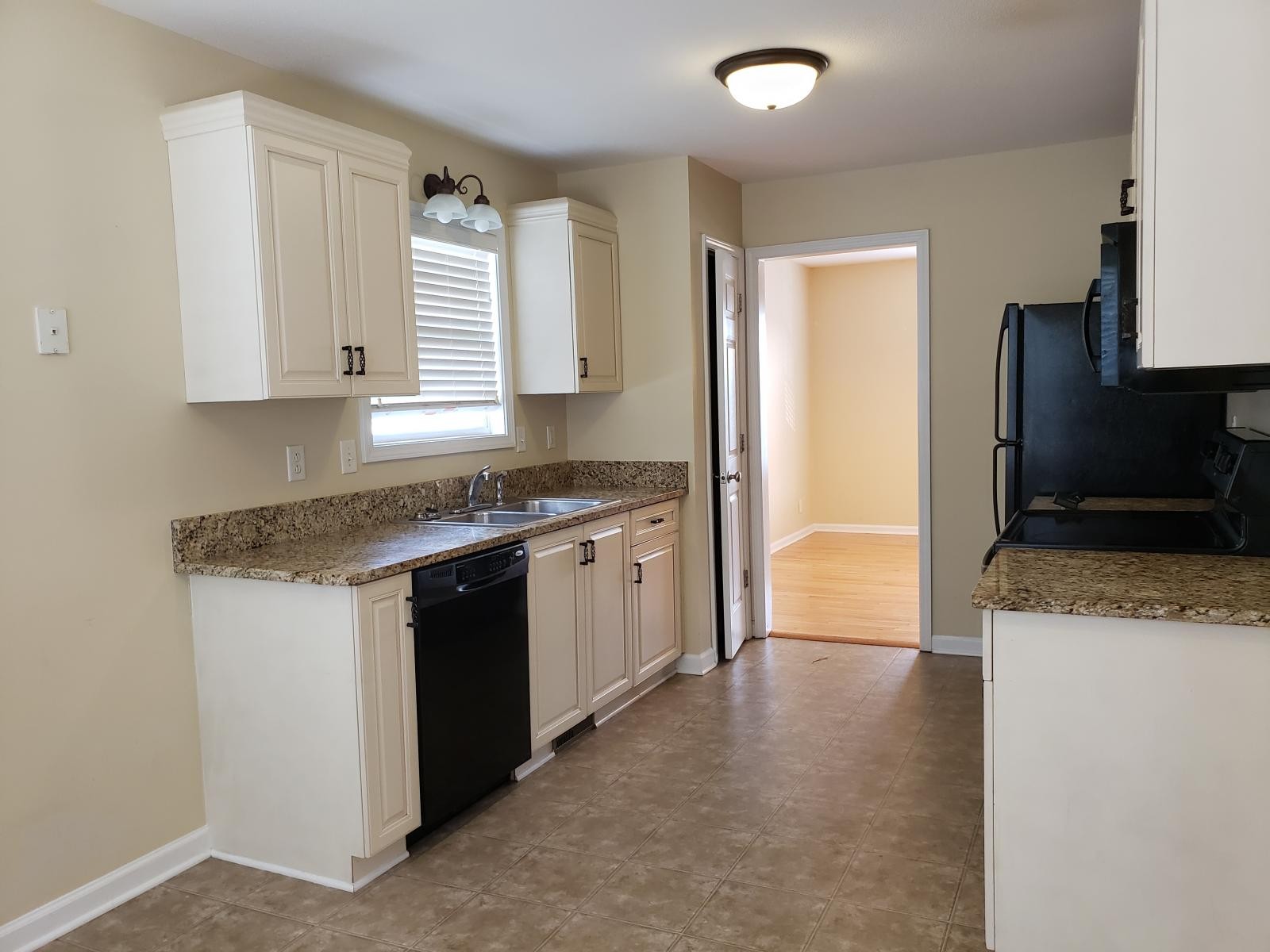 220 Cheshire Road Clarksville, TN 37043 - Photo 5 of 17 a kitchen with stainless steel appliances granite countertop a stove a sink and a refrigerator