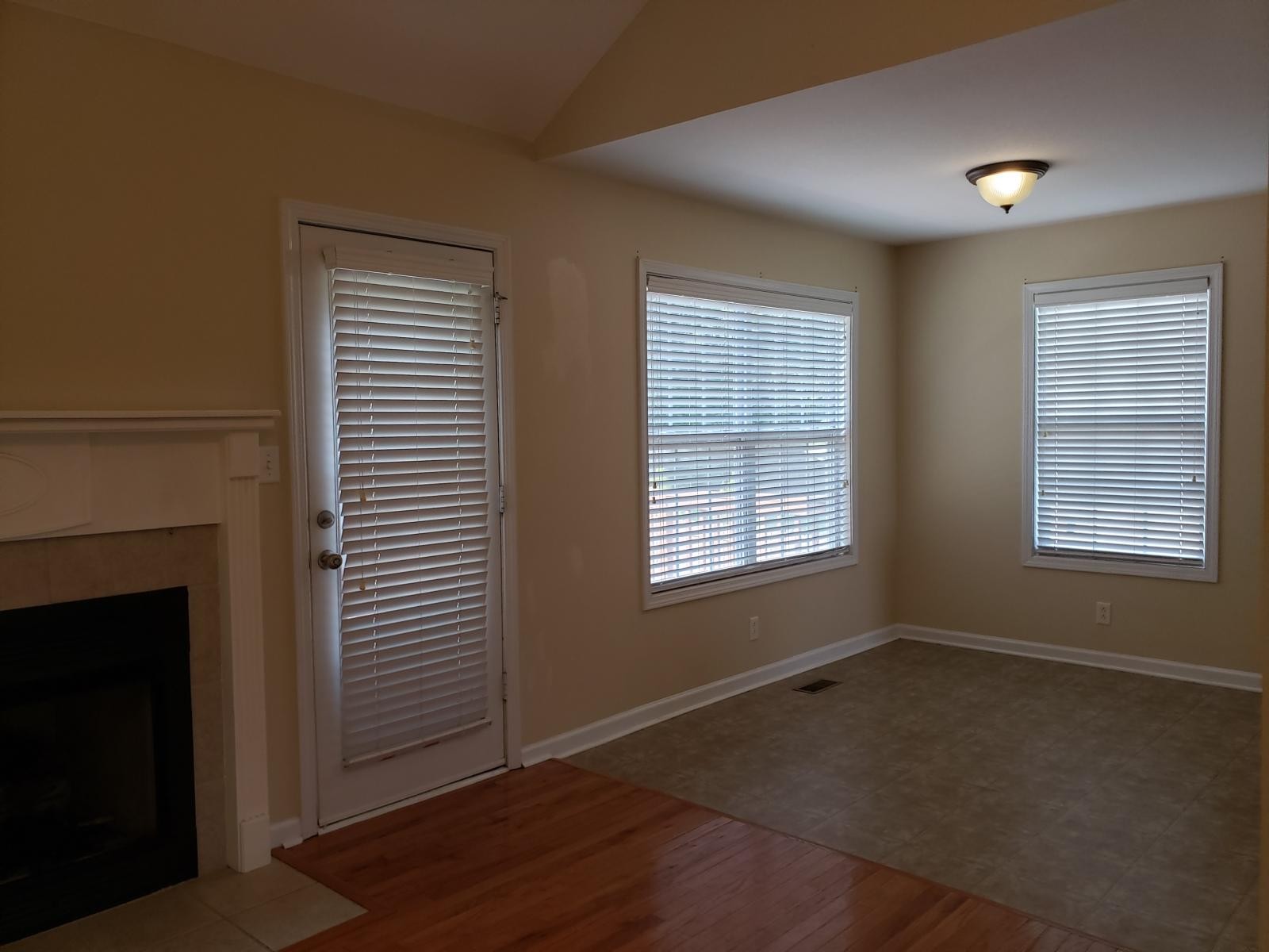 220 Cheshire Road Clarksville, TN 37043 - Photo 6 of 17 a view of an empty room with wooden floor and a window