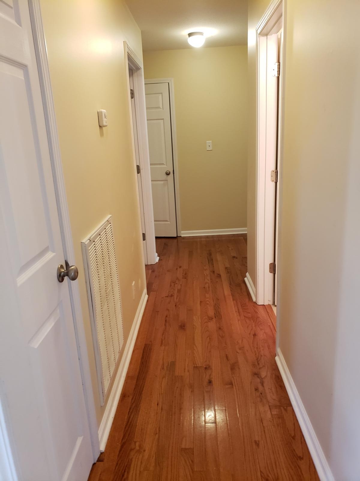 220 Cheshire Road Clarksville, TN 37043 - Photo 7 of 17 a view of a hallway with wooden floor and staircase
