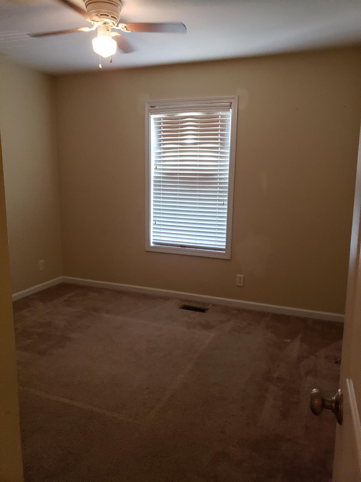 220 Cheshire Road Clarksville, TN 37043 - Photo 9 of 17 a view of an empty room with a window
