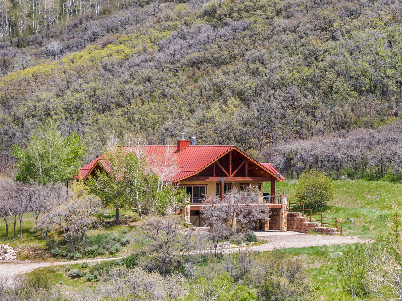 31485 Deerwood Ranch Road Steamboat Springs, CO 80487 - Photo 1 of 49 an aerial view of a house