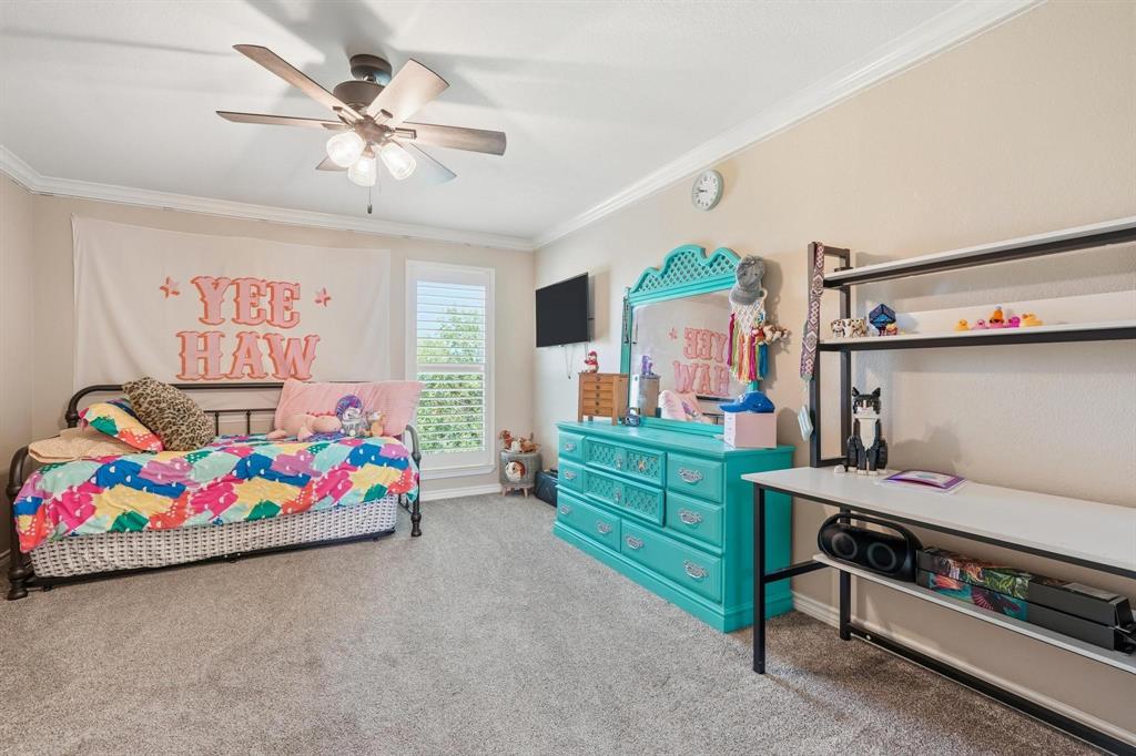 432 Clark Road Abilene, TX 79602 - Photo 24 of 40 a bedroom with furniture and a baby crib