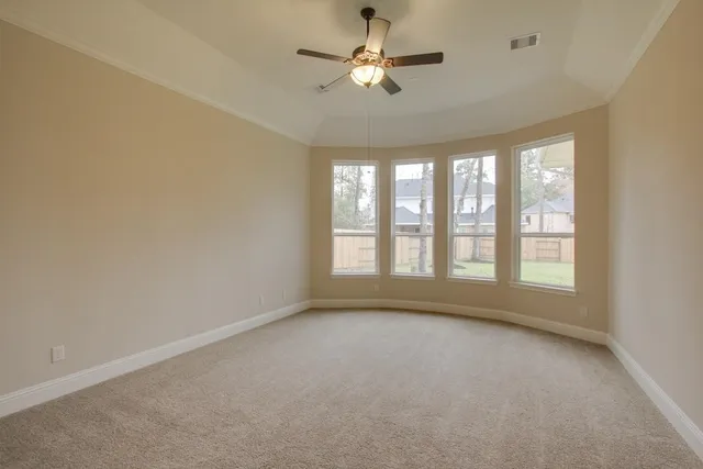 a view of room with a ceiling fan and window