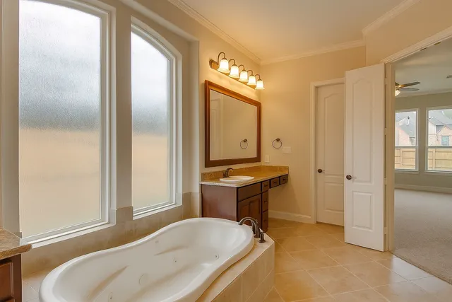 a bathroom with a tub and a sink