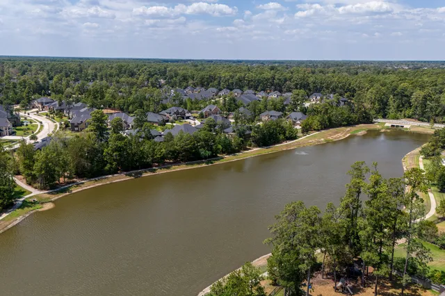 an aerial view of a houses with ocean view