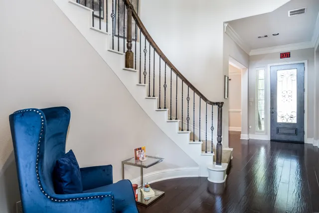 a view of entryway and hall with wooden floor