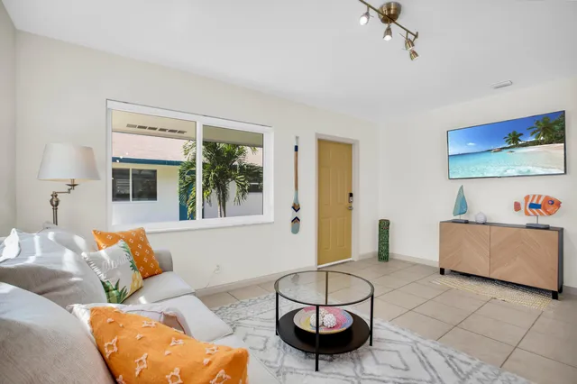 a living room with furniture and a window