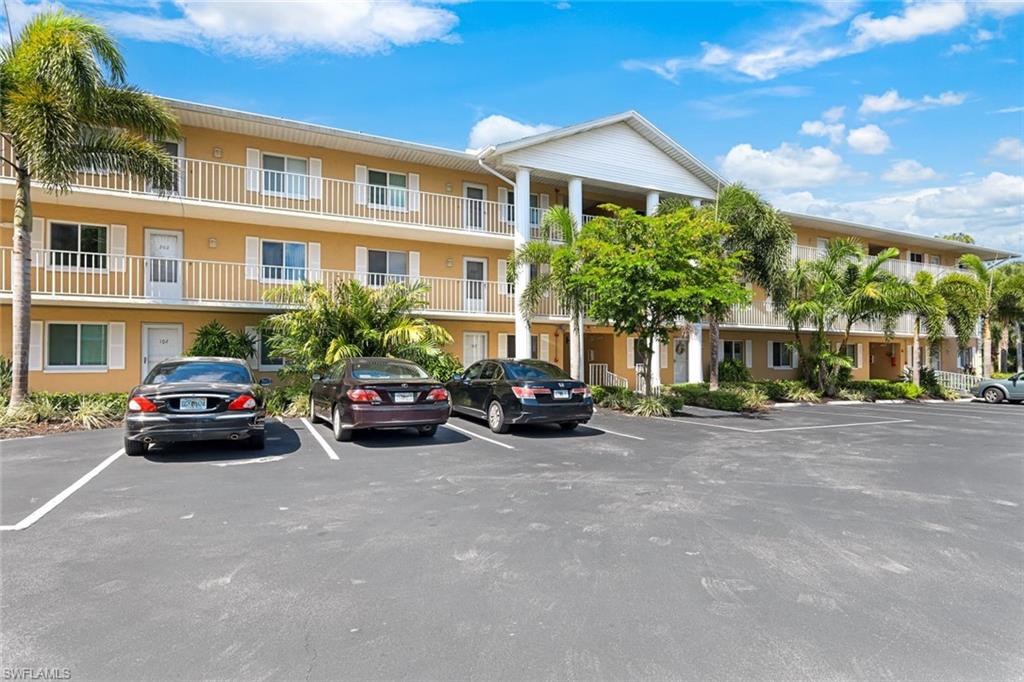 3041 Sandpiper Bay Circle, Unit H203 Naples, FL 34112 - Photo 18 of 23 a view of a street in front of a building