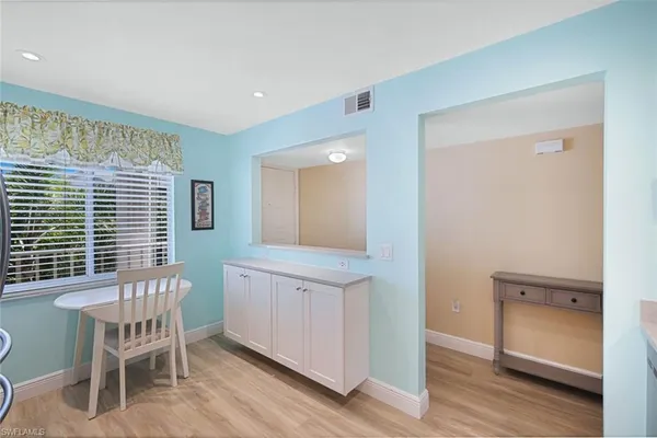 a kitchen with cabinets and stainless steel appliances