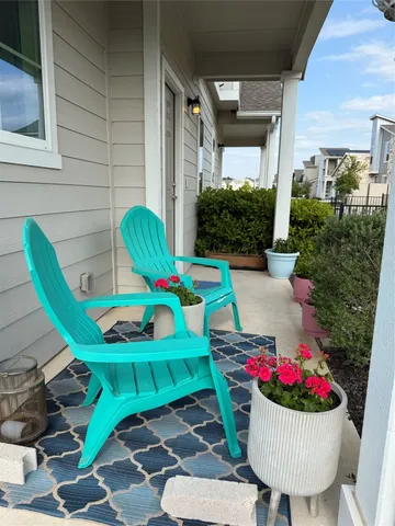 a view of a chairs and table in backyard