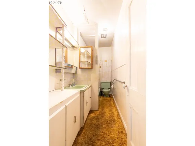 a bathroom with a sink a mirror and a bathtub