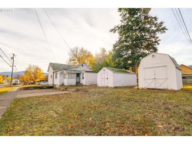 a big house with a big yard and large trees