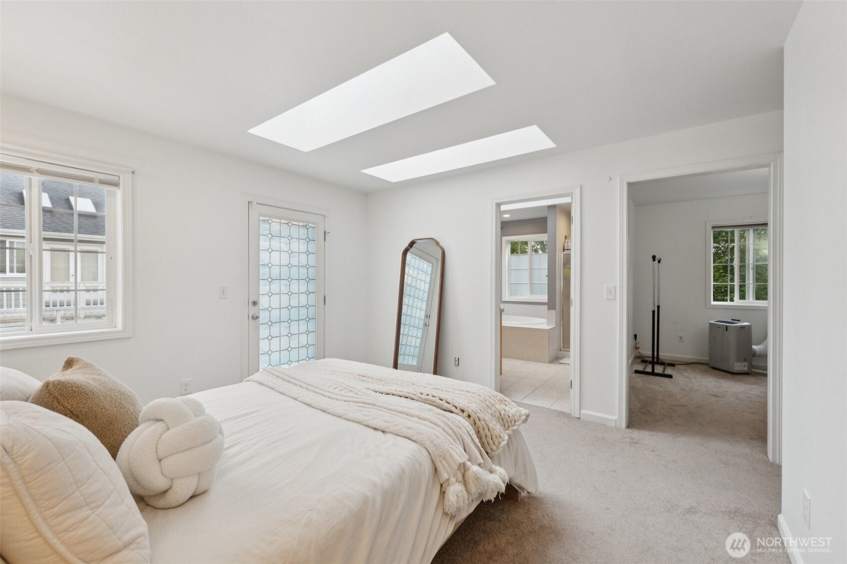 2750 Diamond Loop, Unit E Milton, WA 98354 - Photo 15 of 29 a bedroom with a bed and a large window