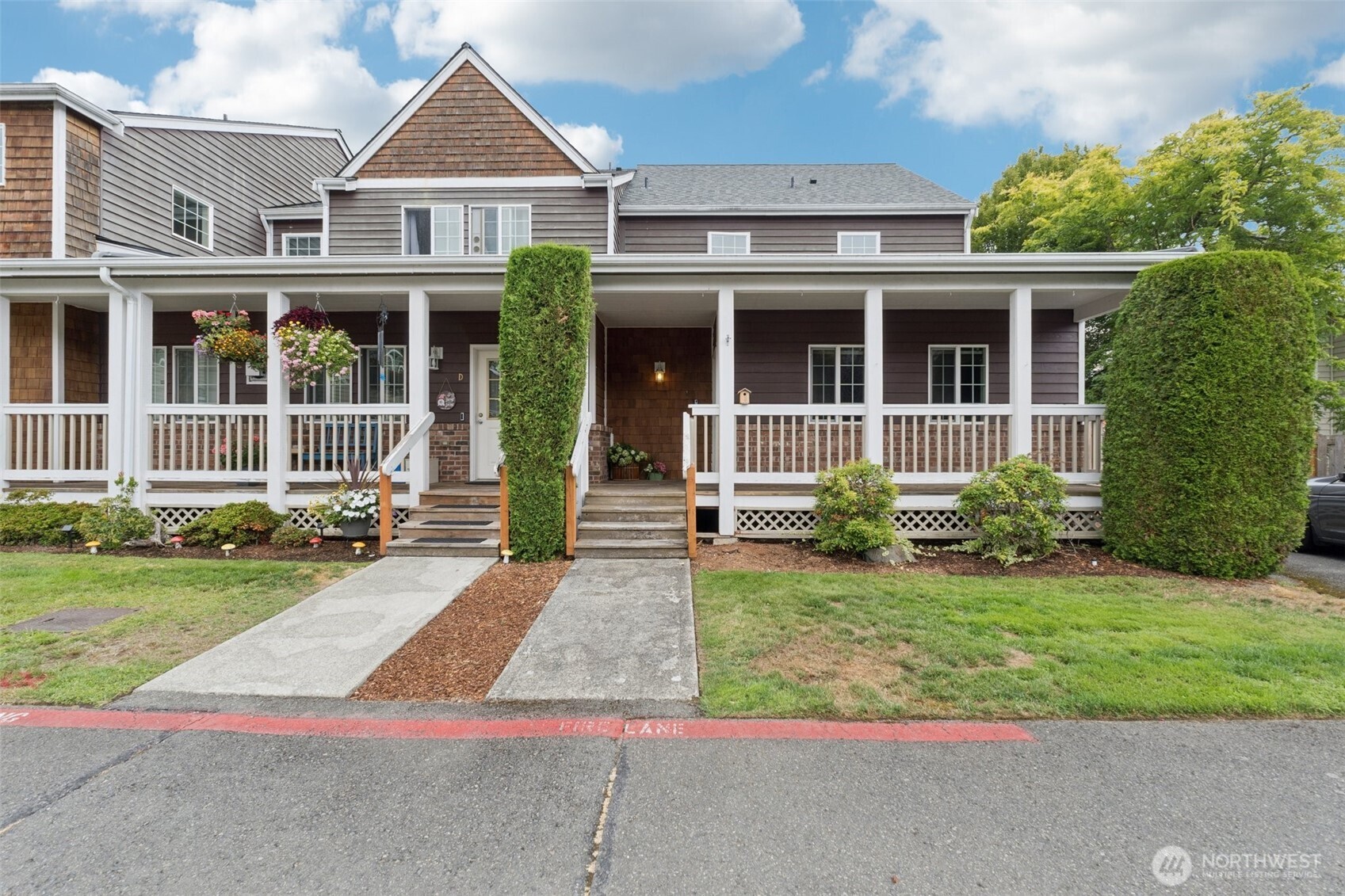 2750 Diamond Loop, Unit E Milton, WA 98354 - Photo 2 of 29 front view of a house with a yard