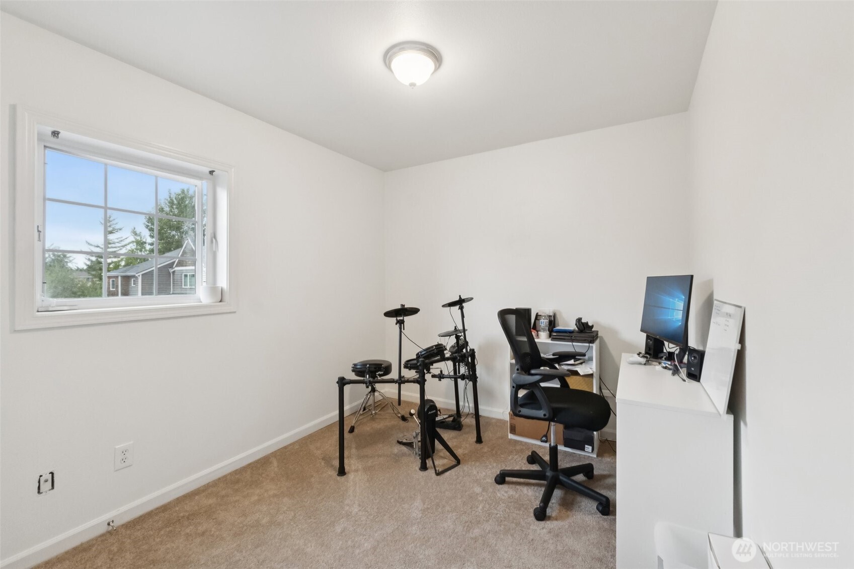 2750 Diamond Loop, Unit E Milton, WA 98354 - Photo 21 of 29 a view of a workspace with furniture and a window