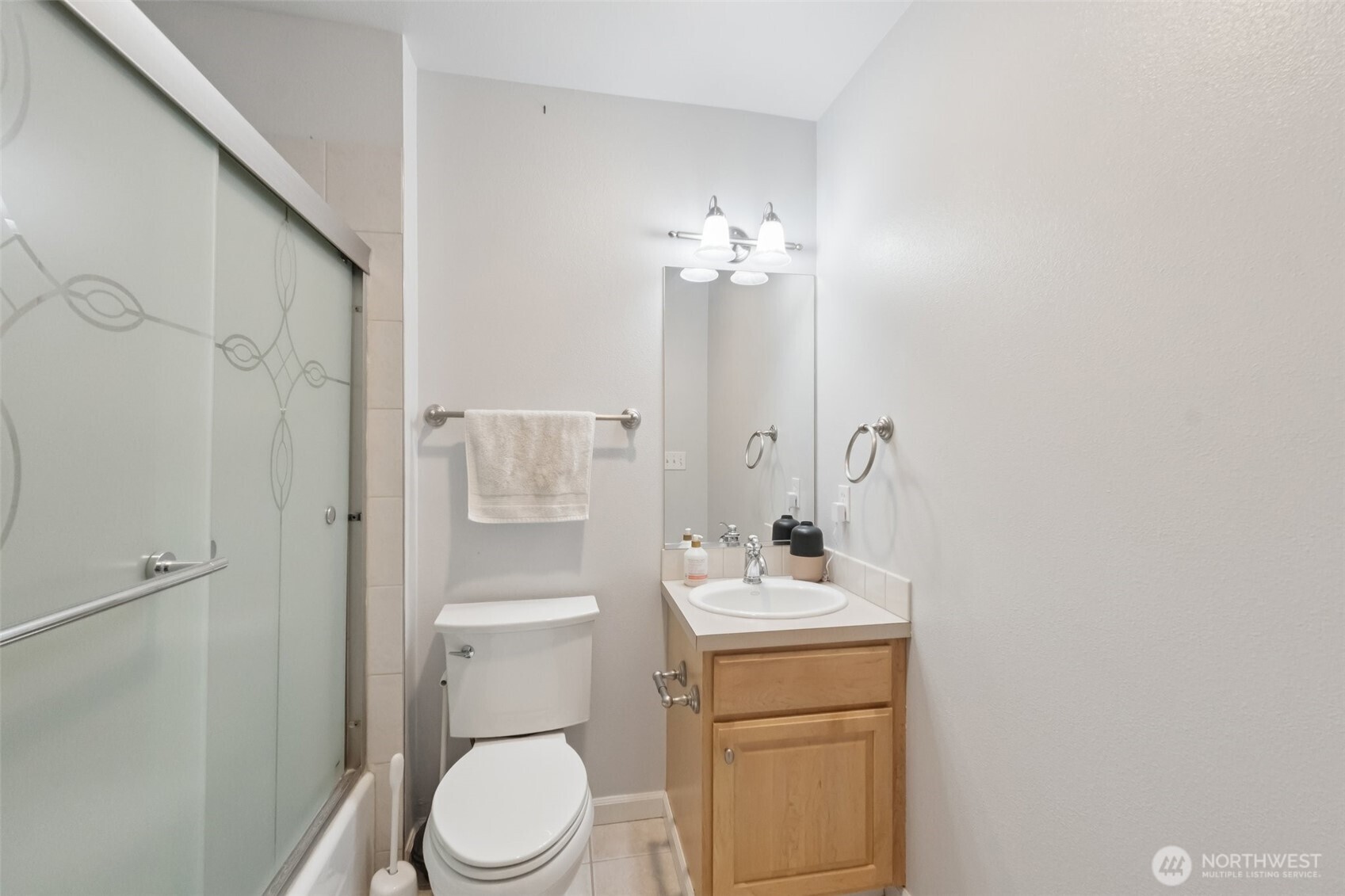 2750 Diamond Loop, Unit E Milton, WA 98354 - Photo 22 of 29 a bathroom with a sink a toilet and shower