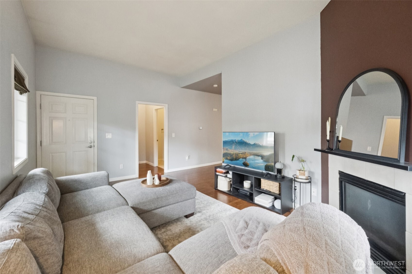2750 Diamond Loop, Unit E Milton, WA 98354 - Photo 4 of 29 a living room with furniture a fireplace and a potted plant