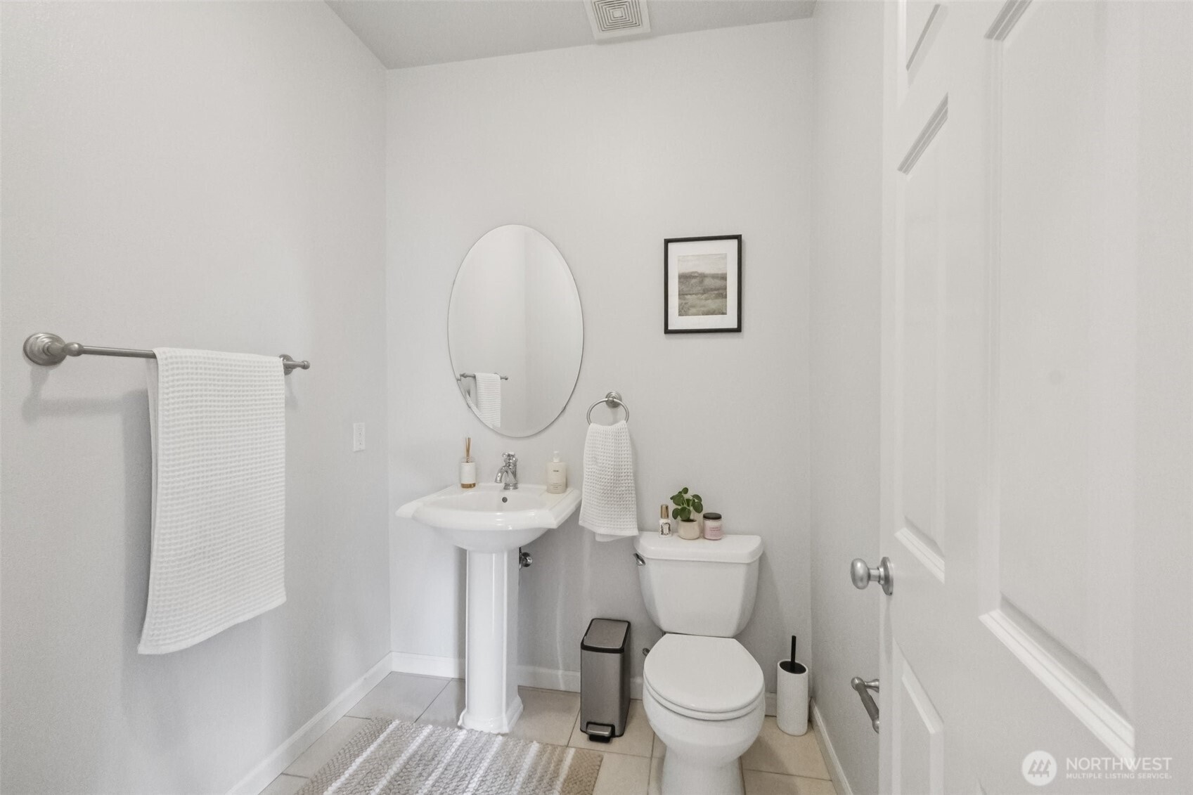 2750 Diamond Loop, Unit E Milton, WA 98354 - Photo 8 of 29 a bathroom with a toilet sink and mirror