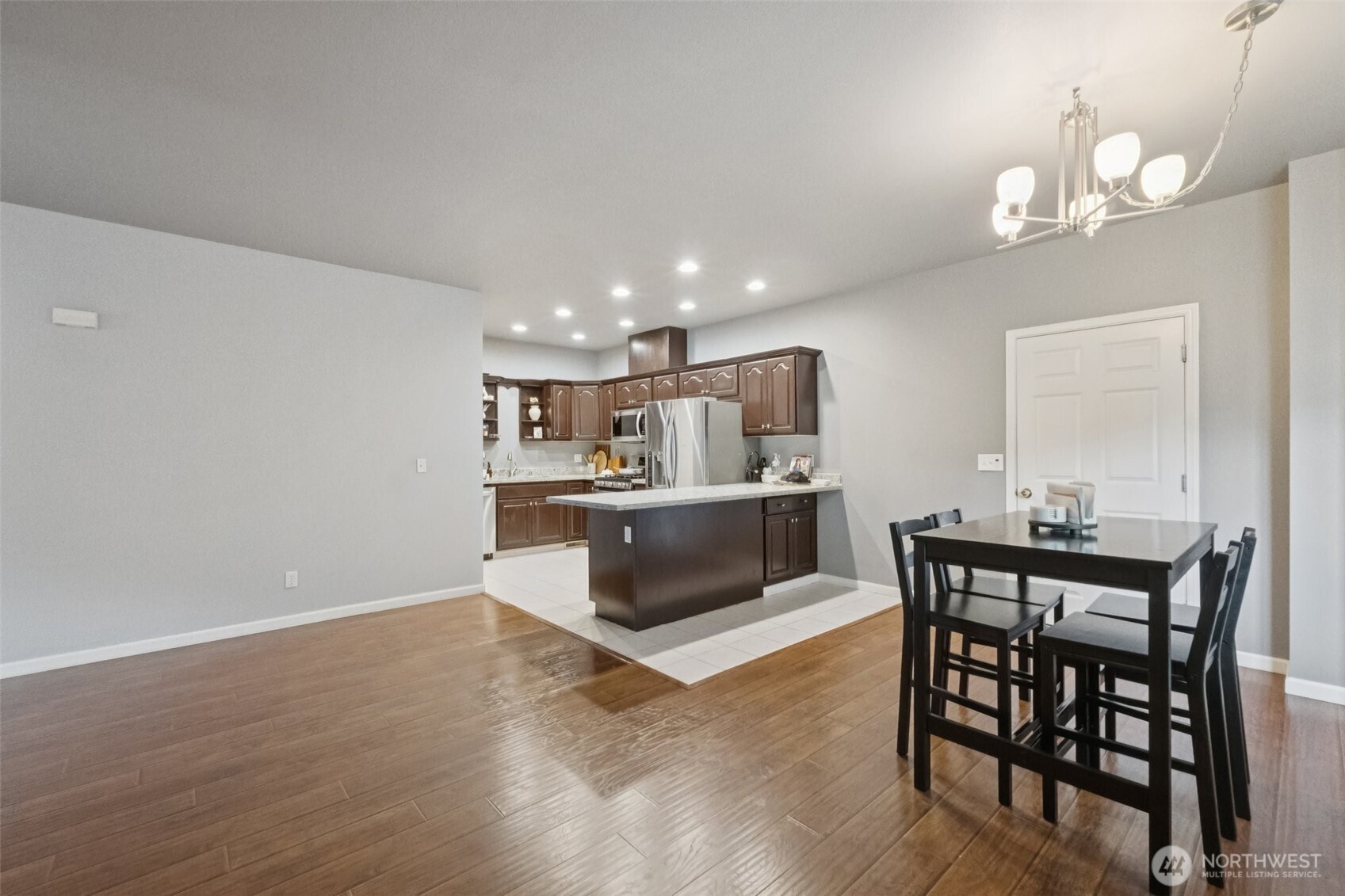 2750 Diamond Loop, Unit E Milton, WA 98354 - Photo 9 of 29 a view of kitchen with cabinets and wooden floor