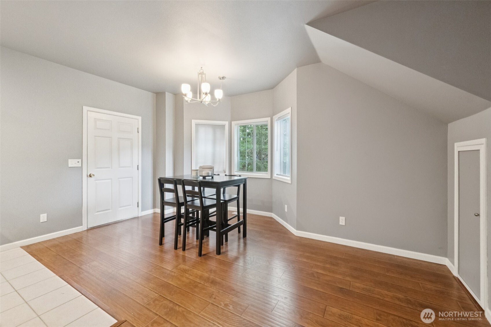 2750 Diamond Loop, Unit E Milton, WA 98354 - Photo 10 of 29 an empty room with wooden floor and windows