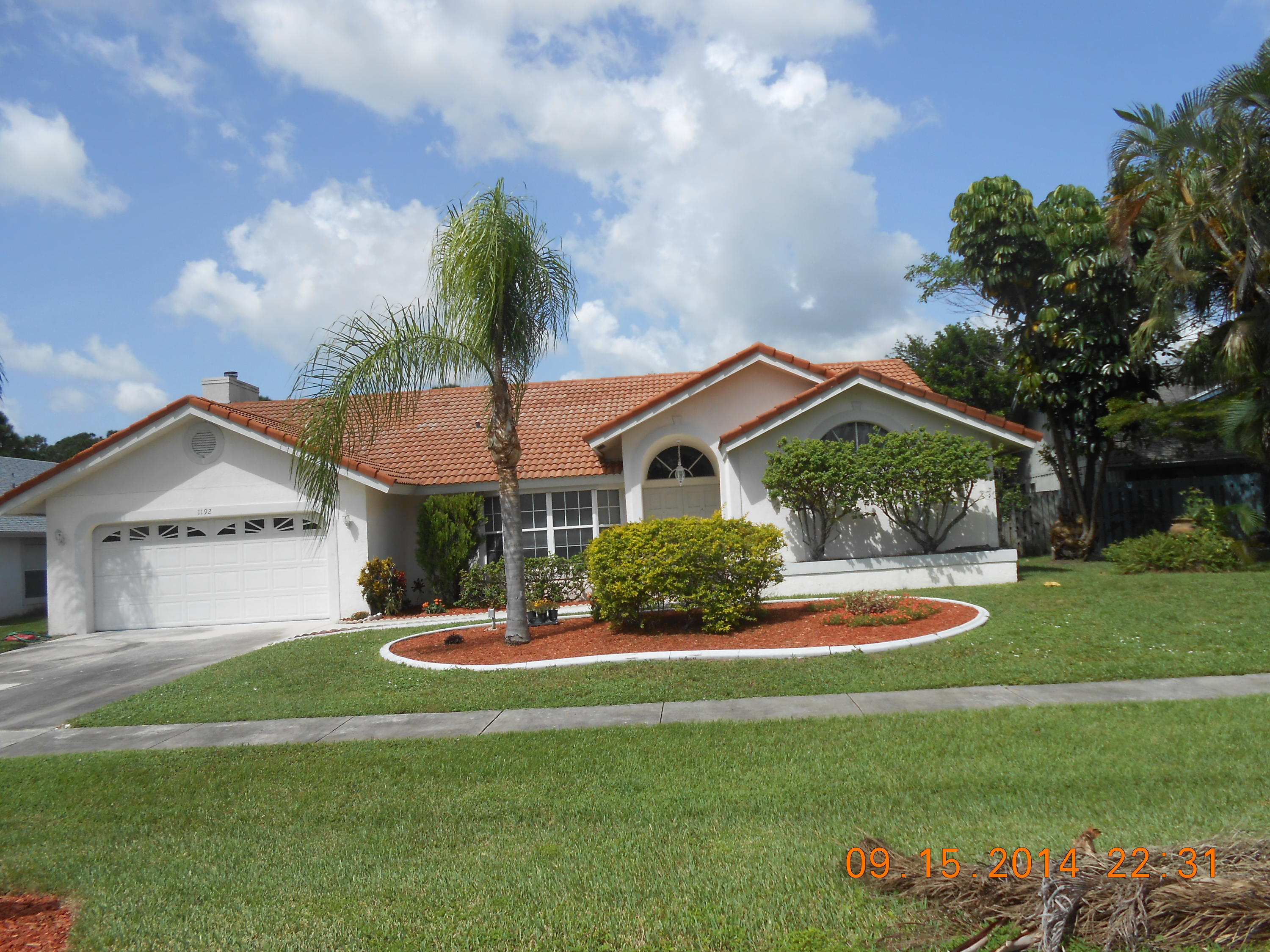 1192 Raintree Lane Wellington, FL 33414 - Photo 1 of 5 Front Exterior