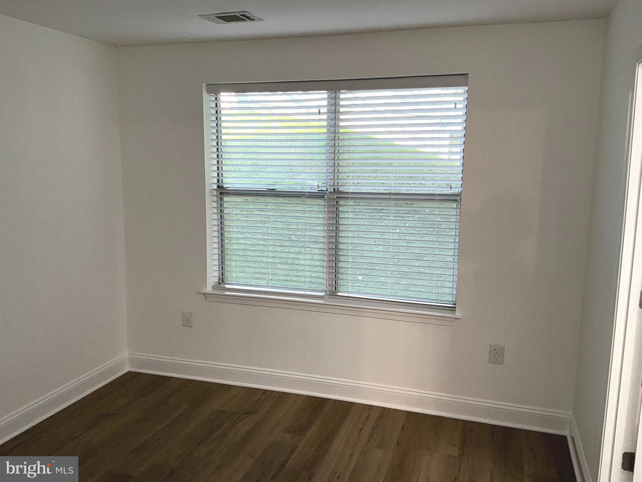 10003 Vanderbilt Circle, Unit 11 Rockville, MD 20850 - Photo 12 of 23 an empty room with a window