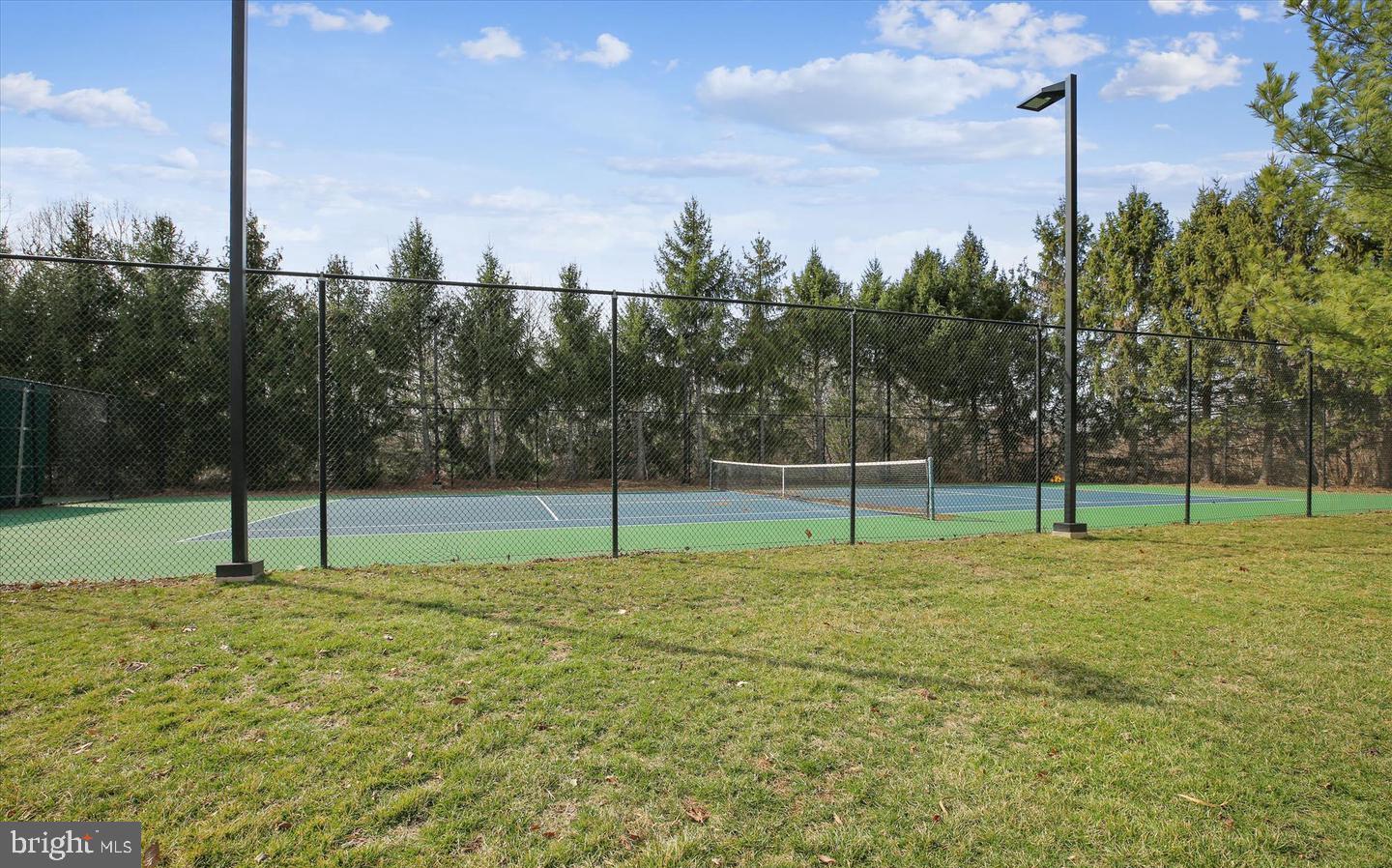 10003 Vanderbilt Circle, Unit 11 Rockville, MD 20850 - Photo 22 of 23 a swimming pool with a big yard