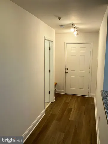 a kitchen with stainless steel appliances granite countertop a sink a stove and a microwave