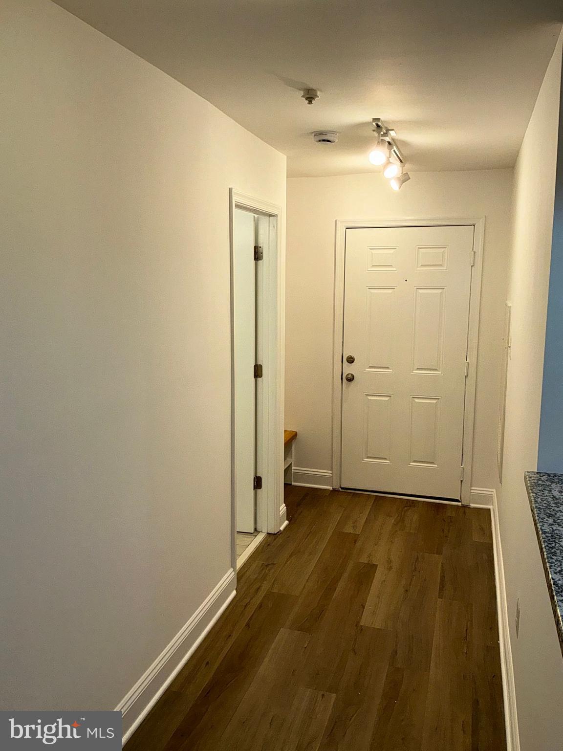 10003 Vanderbilt Circle, Unit 11 Rockville, MD 20850 - Photo 3 of 23 wooden floor in an empty room