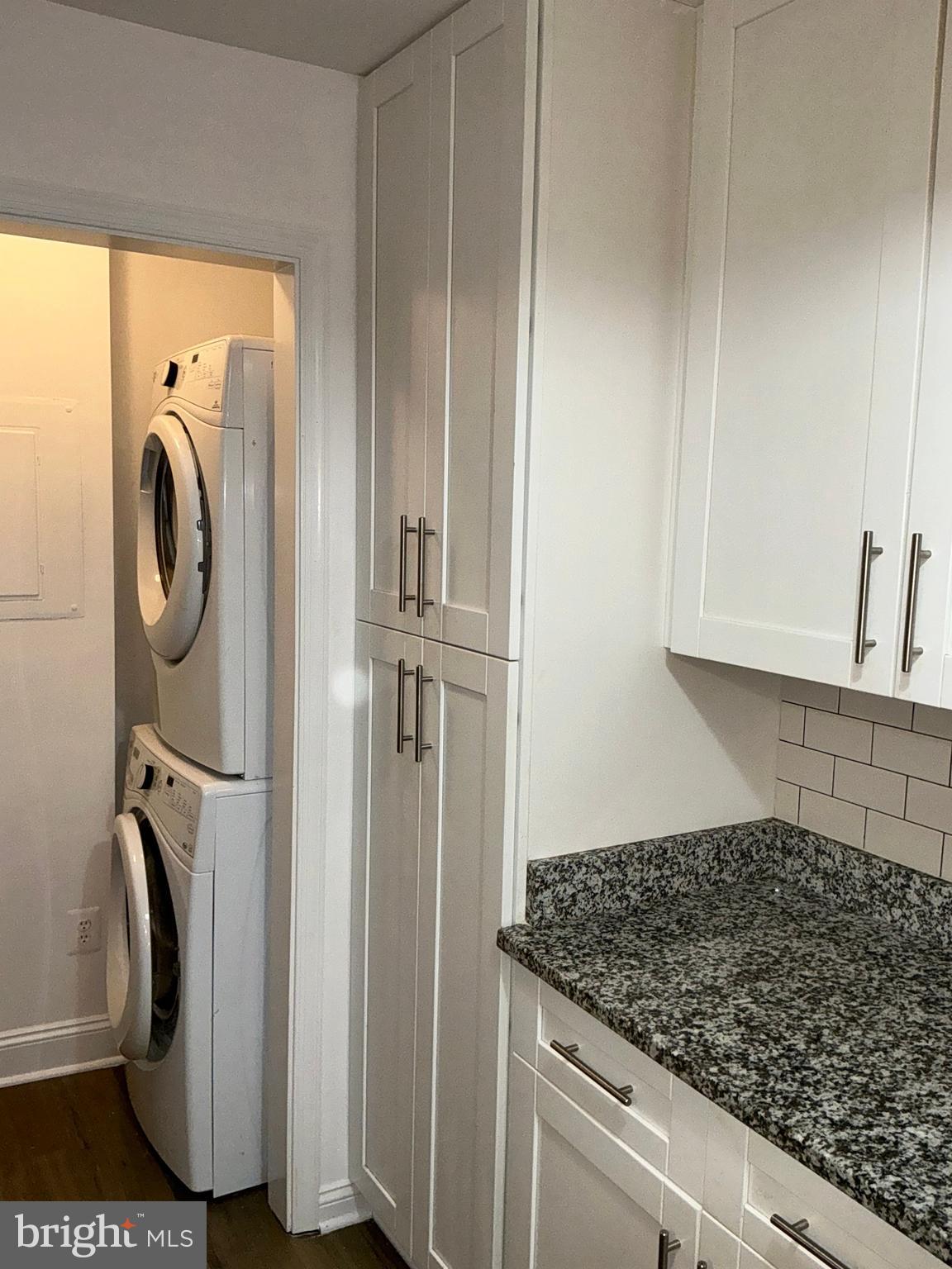10003 Vanderbilt Circle, Unit 11 Rockville, MD 20850 - Photo 7 of 23 a view of bathroom with washer and dryer