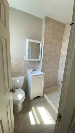 a bathroom with a toilet and a sink