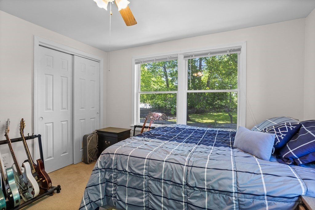 56 Lake Shore Road Salem, NH 03079 - Photo 19 of 39 a bedroom with a bed and a window