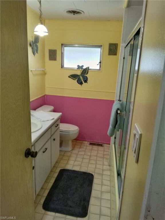 519 Riviera Boulevard East Naples, FL 34112 - Photo 13 of 23 Bathroom with vanity and a stall shower