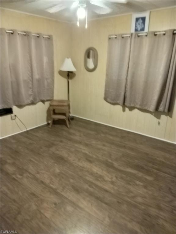 519 Riviera Boulevard East Naples, FL 34112 - Photo 14 of 23 Unfurnished room featuring ceiling fan and wood finished floors