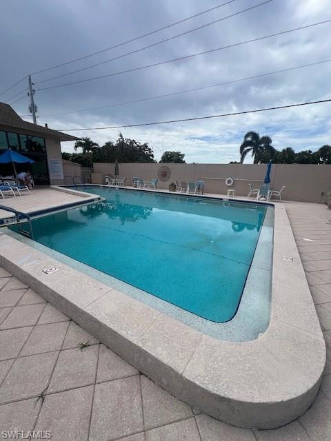 519 Riviera Boulevard East Naples, FL 34112 - Photo 21 of 23 Community pool with a patio