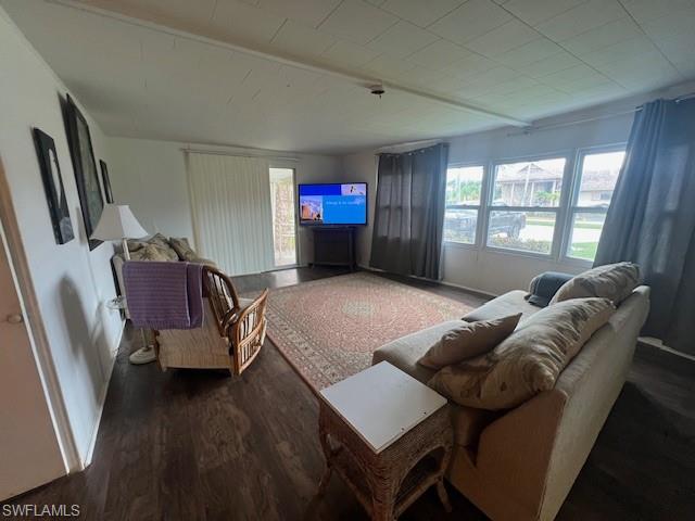 519 Riviera Boulevard East Naples, FL 34112 - Photo 5 of 23 Living area with plenty of natural light and wood finished floors